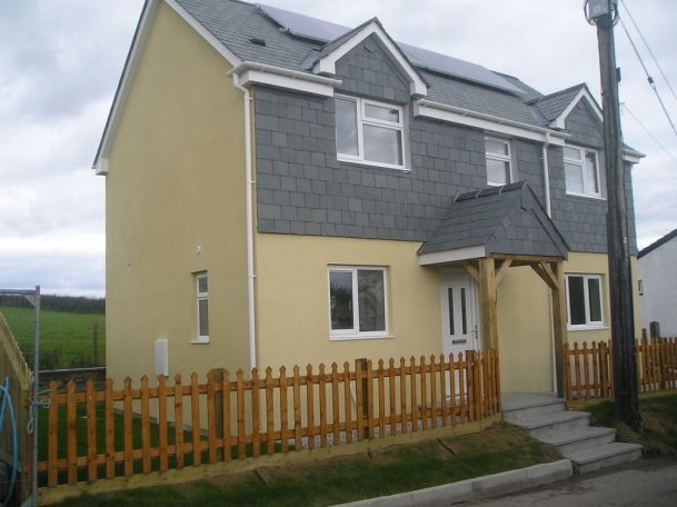coloured render, Lifton. coloured render in yellow on a new house.